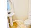 Cozy half-bath with pedestal sink and a tiled floor at 6043 Cape Clairmont Ct, North Las Vegas, NV 89031