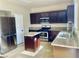 Well-equipped kitchen features granite countertops, stainless steel appliances, and a convenient island for meal preparation at 6043 Cape Clairmont Ct, North Las Vegas, NV 89031