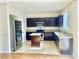 Well-appointed kitchen with granite countertops, stainless steel appliances, a functional island, and ample cabinet space at 6043 Cape Clairmont Ct, North Las Vegas, NV 89031
