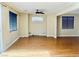 Spacious living area with sleek floors and a ceiling fan, providing a comfortable and stylish space for relaxation at 6043 Cape Clairmont Ct, North Las Vegas, NV 89031