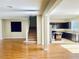 Open-concept living room and kitchen with wood and tile floors at 6043 Cape Clairmont Ct, North Las Vegas, NV 89031