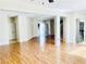 Open-concept living area with sleek floors, neutral paint, and seamless flow into other spaces, ideal for modern living at 6043 Cape Clairmont Ct, North Las Vegas, NV 89031