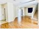 Spacious living room boasts sleek floors, neutral paint, and a staircase, perfect for Gathering gatherings and entertaining guests at 6043 Cape Clairmont Ct, North Las Vegas, NV 89031