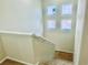 Carpeted stairway leading to the second floor with square windows at 6043 Cape Clairmont Ct, North Las Vegas, NV 89031