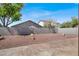 A spacious backyard with rock landscaping, a patio, and a block wall for privacy at 612 Moontide Ct, Henderson, NV 89011
