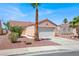 Charming single-story home with a two-car garage and desert landscaping in a sunny neighborhood at 612 Moontide Ct, Henderson, NV 89011
