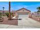 Charming single-story home with a two-car garage and desert landscaping in a sunny neighborhood at 612 Moontide Ct, Henderson, NV 89011