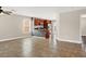 Open-concept living area featuring tile flooring, views into the kitchen, and stainless steel appliances at 612 Moontide Ct, Henderson, NV 89011