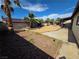 Expansive backyard featuring desert landscaping, mature palm trees, and space for outdoor living and recreation at 6402 Agua Dr, Las Vegas, NV 89103