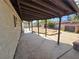 Backyard featuring a covered patio, ample space, mature trees and direct access to the home at 6402 Agua Dr, Las Vegas, NV 89103
