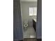 Bathroom with a toilet and a modern vanity with a dark cabinet at 6402 Agua Dr, Las Vegas, NV 89103