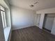 This bedroom features wood floors, a window for natural light, and a closet for storage at 6402 Agua Dr, Las Vegas, NV 89103