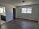 This bedroom features wood floors and an ensuite bathroom and closet at 6402 Agua Dr, Las Vegas, NV 89103