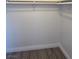 Interior view of the bedroom closet with wood floors and a closet rod at 6402 Agua Dr, Las Vegas, NV 89103
