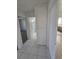 Hallway with tile flooring, closet, and access to the bathroom and bedroom at 6402 Agua Dr, Las Vegas, NV 89103