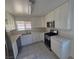 Modern kitchen with stainless steel appliances, white cabinets, and ample counter space, perfect for cooking and entertaining at 6402 Agua Dr, Las Vegas, NV 89103