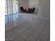 Open living area with tile flooring and sliding glass doors to the exterior at 6402 Agua Dr, Las Vegas, NV 89103