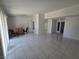 Open-concept living and dining area offers tile flooring and bright natural light at 6402 Agua Dr, Las Vegas, NV 89103