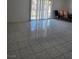 Bright living area with tile flooring and sliding glass doors for natural light at 6402 Agua Dr, Las Vegas, NV 89103
