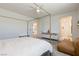 Bright bedroom with four-poster bed, hardwood floors, and modern decor at 6927 Desert Finch St, North Las Vegas, NV 89084