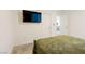 Bedroom featuring a TV on the wall and neutral walls at 6927 Desert Finch St, North Las Vegas, NV 89084