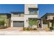 Modern two-story home with stone accents, desert landscaping, and a two-car garage at 6927 Desert Finch St, North Las Vegas, NV 89084