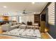 Spacious living area with open layout, combining a modern kitchen, comfortable seating, and stylish decor at 6927 Desert Finch St, North Las Vegas, NV 89084