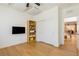 Home office features a sleek desk, modern lighting, and a wall-mounted TV at 6927 Desert Finch St, North Las Vegas, NV 89084