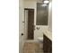 Bathroom with stand up shower with tile surround, toilet, and vanity with granite countertop at 728 Apple Tree Ct, Henderson, NV 89014