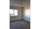 Clean and neutral carpeted room, illuminated by natural light through a window at 728 Apple Tree Ct, Henderson, NV 89014