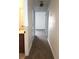 Hallway with carpeted floor, with access to rooms, and light fixture at 728 Apple Tree Ct, Henderson, NV 89014
