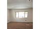 Living room with carpet floors and a window at 728 Apple Tree Ct, Henderson, NV 89014