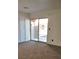 Bright room featuring plush carpeting and sliding glass doors leading to a patio at 728 Apple Tree Ct, Henderson, NV 89014