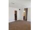 Living room with carpet floors, and access to the kitchen and the bathroom at 728 Apple Tree Ct, Henderson, NV 89014
