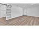 This bedroom features modern barn door closets, neutral paint, and ample space for furniture at 747 Greenbriar Townhouse Way, Las Vegas, NV 89121