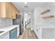 Modern kitchen featuring stainless steel appliances, white countertops, and light wood flooring at 747 Greenbriar Townhouse Way, Las Vegas, NV 89121