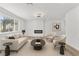 Comfortable living room with modern fireplace, neutral furnishings, and ample natural light at 747 Greenbriar Townhouse Way, Las Vegas, NV 89121