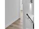 Hallway with modern lighting, clean walls, and sleek wood-look flooring at 747 Greenbriar Townhouse Way, Las Vegas, NV 89121