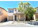 Charming two-story home featuring a covered front porch, desert landscaping, and an attached one-car garage at 7537 Brisa Del Mar Ave, Las Vegas, NV 89179