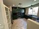 Bright kitchen featuring stainless steel appliances and green cabinetry at 7537 Brisa Del Mar Ave, Las Vegas, NV 89179