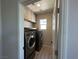 Convenient laundry room with built-in cabinets and modern washer and dryer at 7537 Brisa Del Mar Ave, Las Vegas, NV 89179