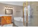 Inviting bathroom featuring an oversized tub and glass shower at 7720 Leavorite Dr, Las Vegas, NV 89128
