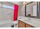 Functional bathroom featuring a tub-shower combo and vanity at 7720 Leavorite Dr, Las Vegas, NV 89128