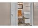 Well-lit bathroom featuring a soaking tub and marble floors at 7720 Leavorite Dr, Las Vegas, NV 89128