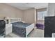 Comfortable bedroom with neutral tones and ample natural light at 7720 Leavorite Dr, Las Vegas, NV 89128