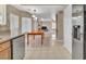 Bright kitchen with stainless steel appliances, tiled flooring, and view to the living room at 7720 Leavorite Dr, Las Vegas, NV 89128