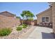 Picturesque backyard featuring a lovely water fountain, patio seating, and desert-friendly landscaping at 7816 Glowing Peak St, Las Vegas, NV 89131