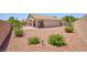 View of the backyard with well-maintained landscaping and patio area at 7816 Glowing Peak St, Las Vegas, NV 89131