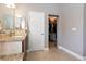 Bathroom featuring granite vanity and walk in closet at 7816 Glowing Peak St, Las Vegas, NV 89131