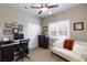 Bedroom featuring a ceiling fan, comfortable seating and a workspace at 7816 Glowing Peak St, Las Vegas, NV 89131